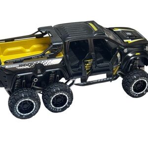 Futuristic Black and Yellow Off-Road Vehicle Toy
